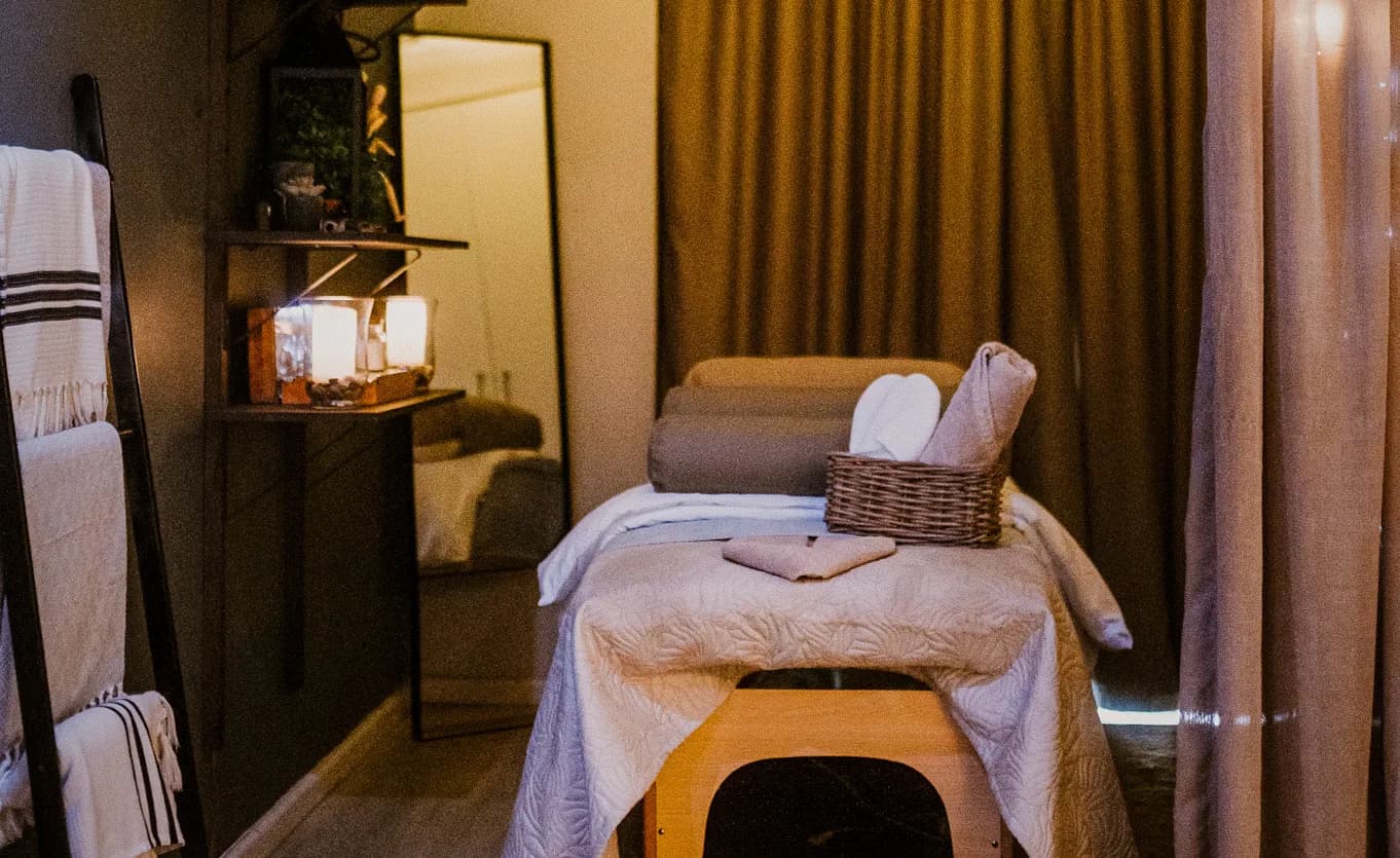 A candlelit treatment room at Woodstock Spa Suite, Cape Town